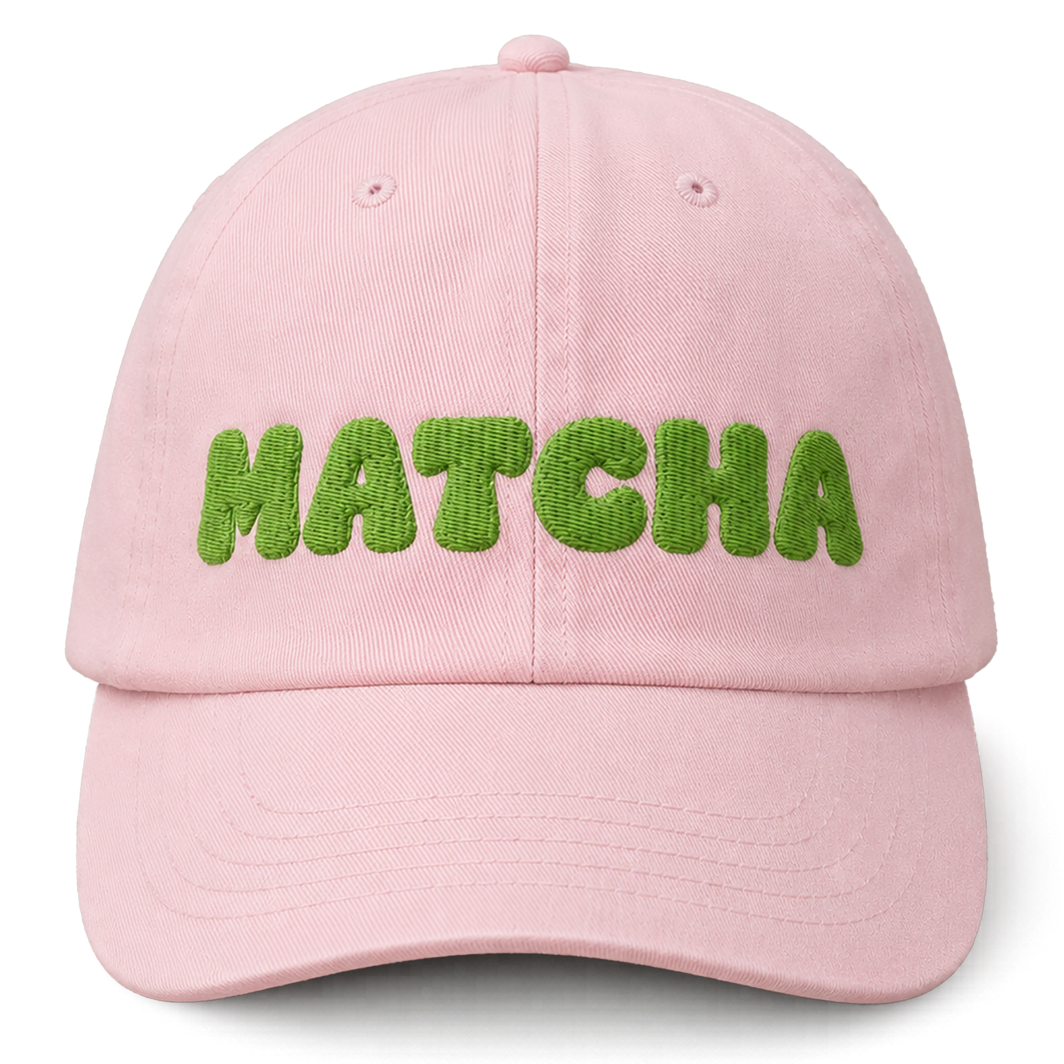 Pink cap with 'MATCHA' in green text on a white background